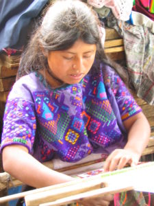 Yabal weaver wearing traditional huipil from Pacutama