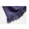 Delicate knots and fringes on each side of the shawl