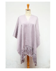 Layered lilac shawl hanging on a mannequin